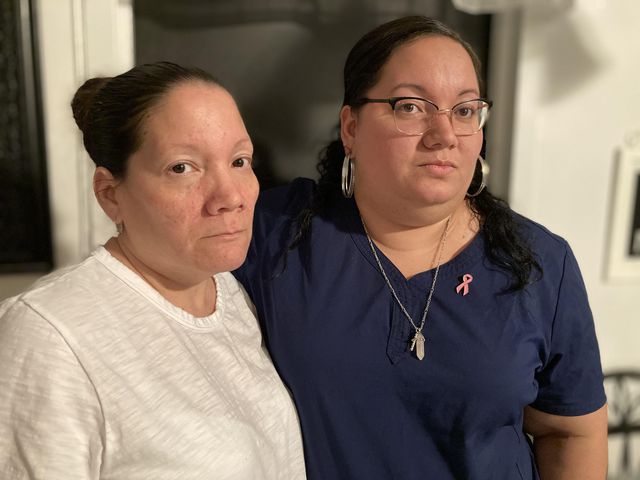 Darlene Perez and Stephanie Negron in their family apartment. Their son/brother is being held at Rikers.